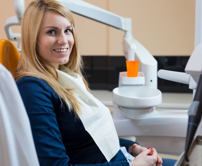 Smiling blonde woman in dental chair at Westerville dental office
