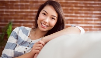 Smiling woman sitting on couch