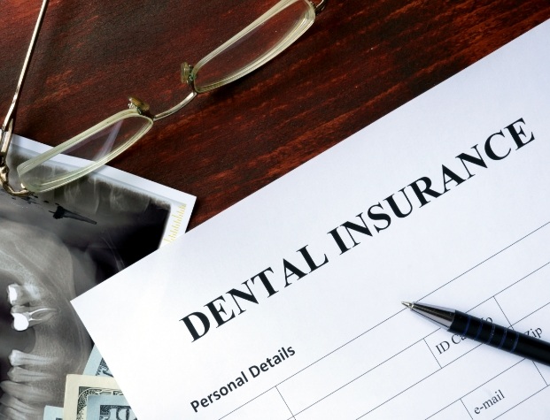 Dental insurance form on table