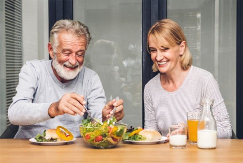 a mature couple enjoying a healthy meal