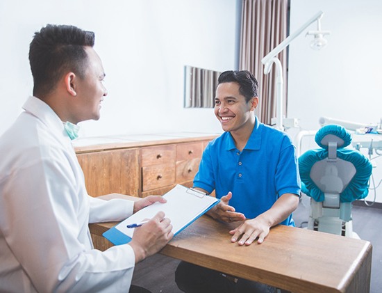 patient and dental professional talking 